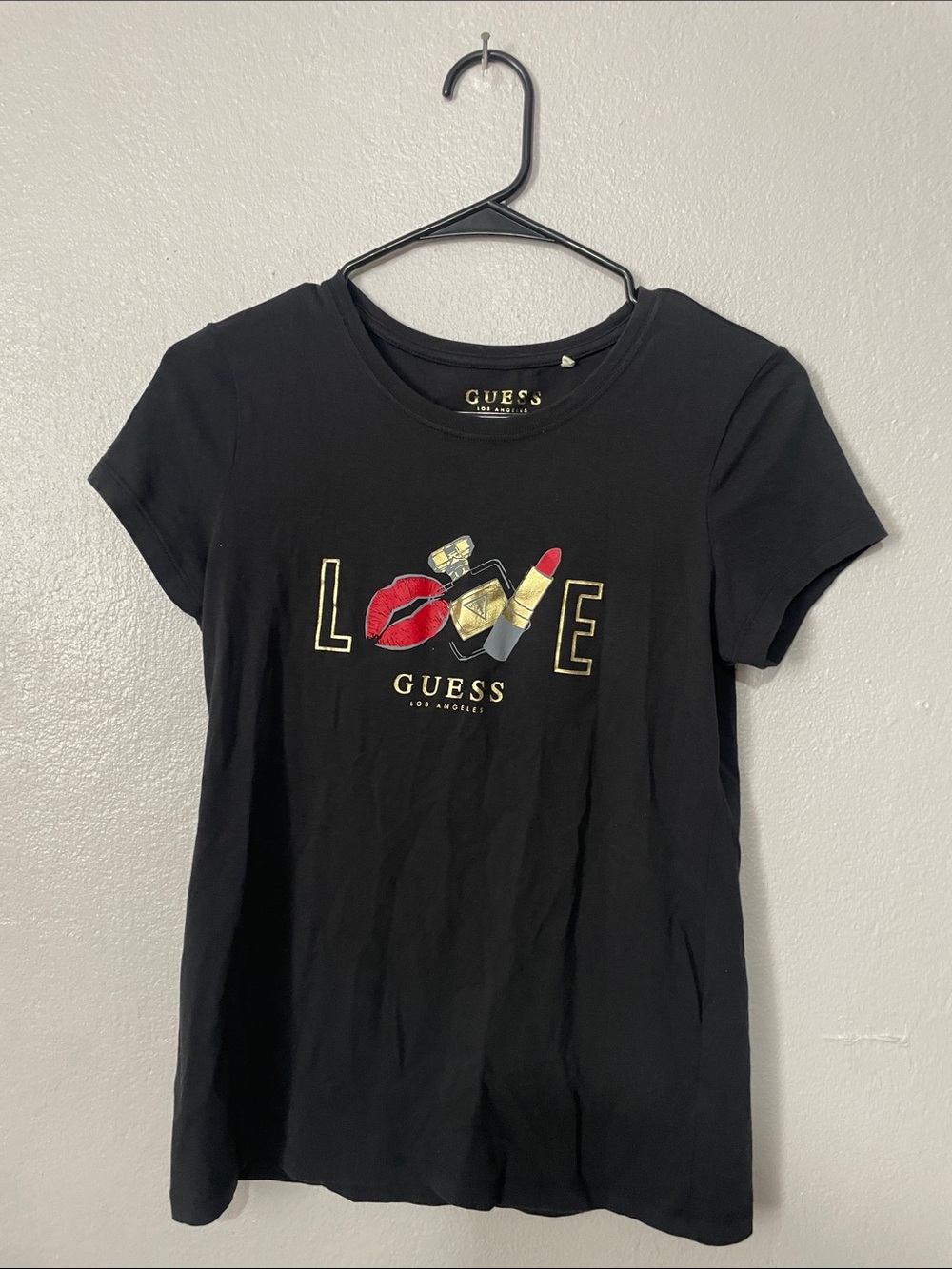 GUESS Black Short-Sleeve Tee with Gold 'LOVE' Graphic and Red Accents